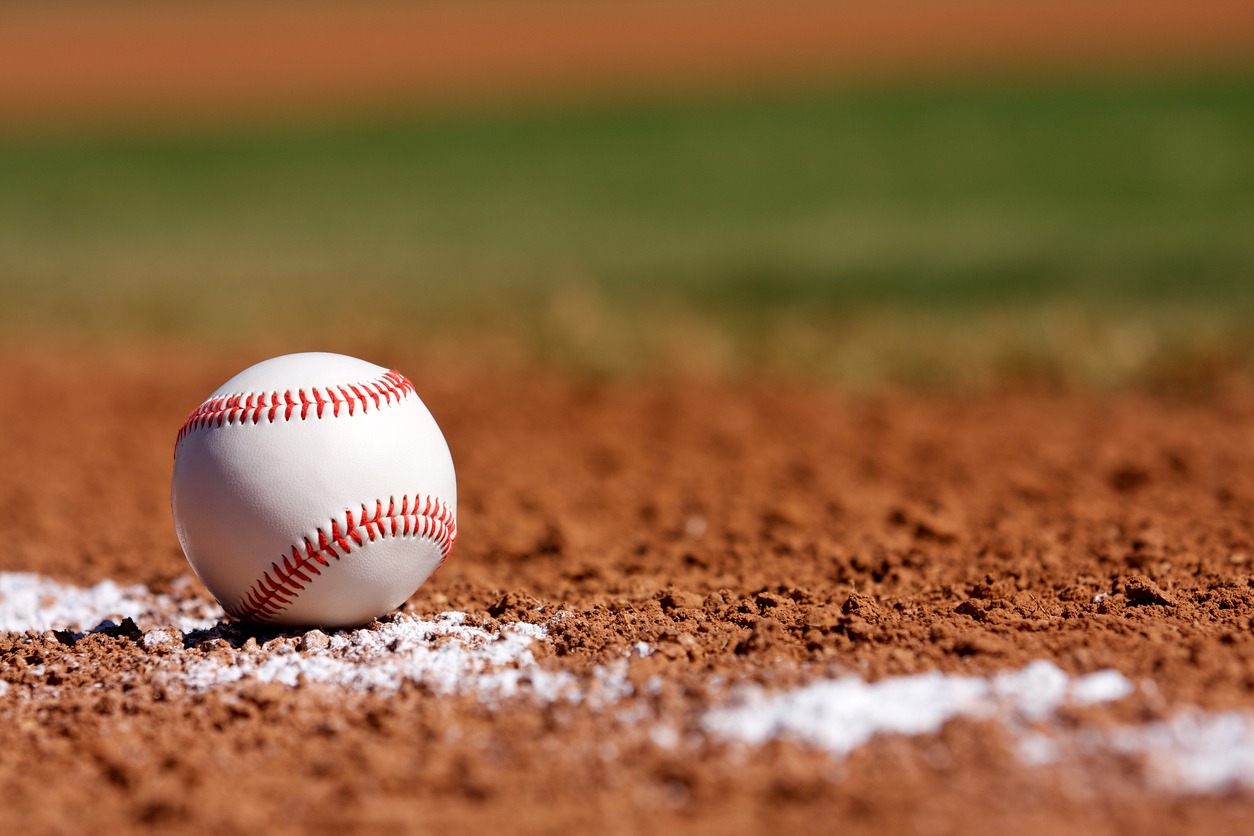 A baseball ball on the ground