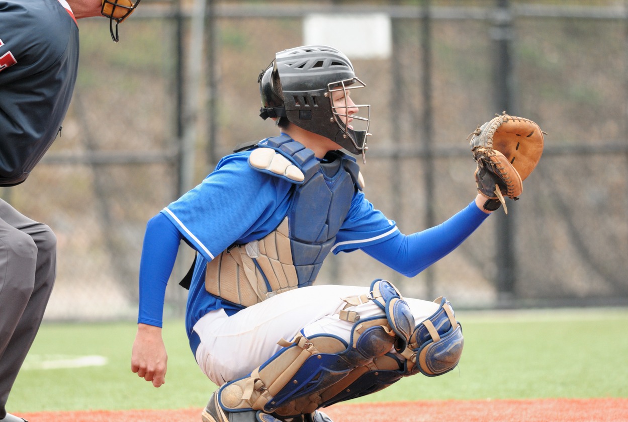 catcher wearing a catcher’s mitt