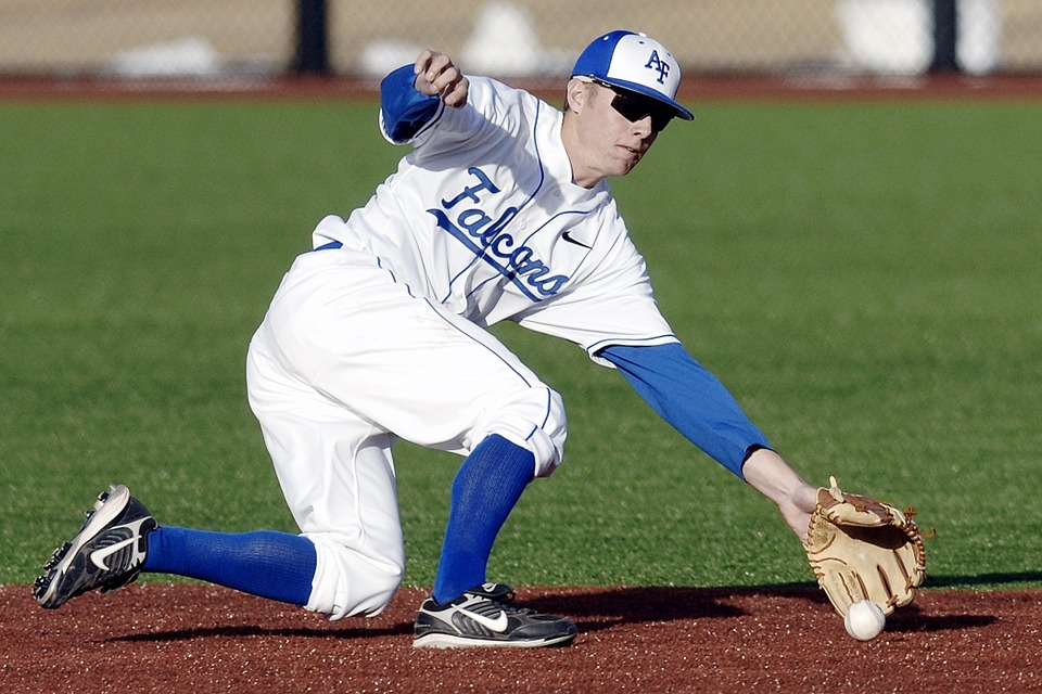 baseball player wearing their team’s hat