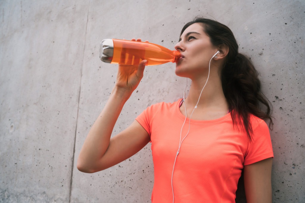 woman drinking sports drink