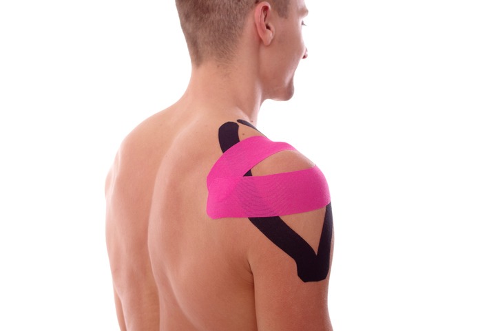 a man wearing kinesiology tape