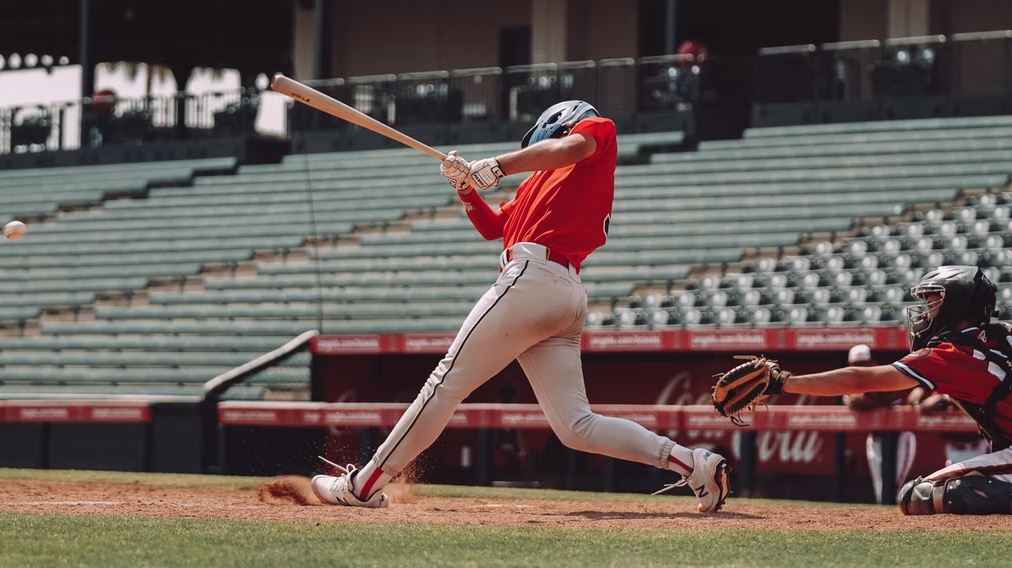 a batter wearing rubber cleats