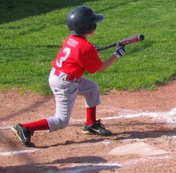 A Little Leaguer executing a bunt
