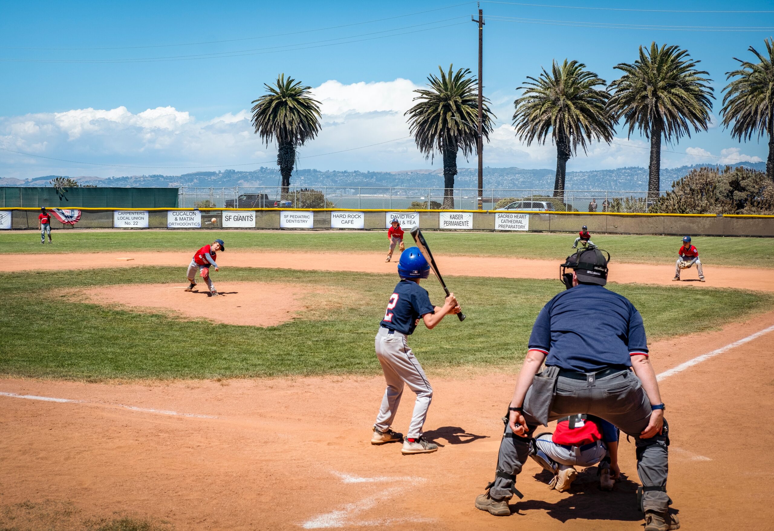 Children playing baseball on the field