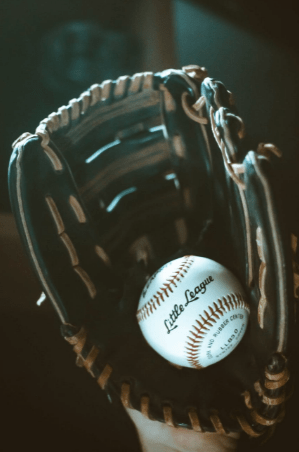 A baseball glove and a baseball