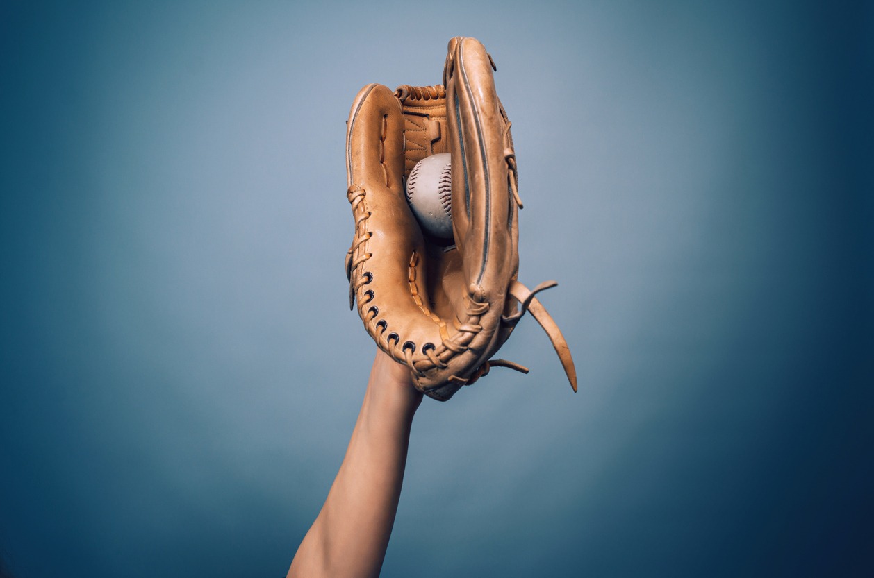 A hand with a leather baseball glove
