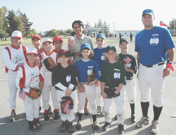 U.S. Secretary of State Condoleezza Rice poses with Little Leaguers from Chile in Santiago